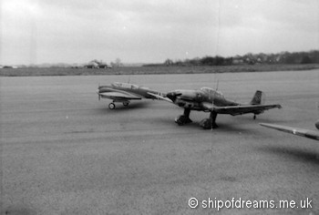 Me. Bf 110 and Stuka on runway